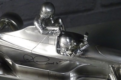 Lot 50 - Nigel Mansell chromed “Taxi for Senna” 1/18th sculpture signed with authenticity