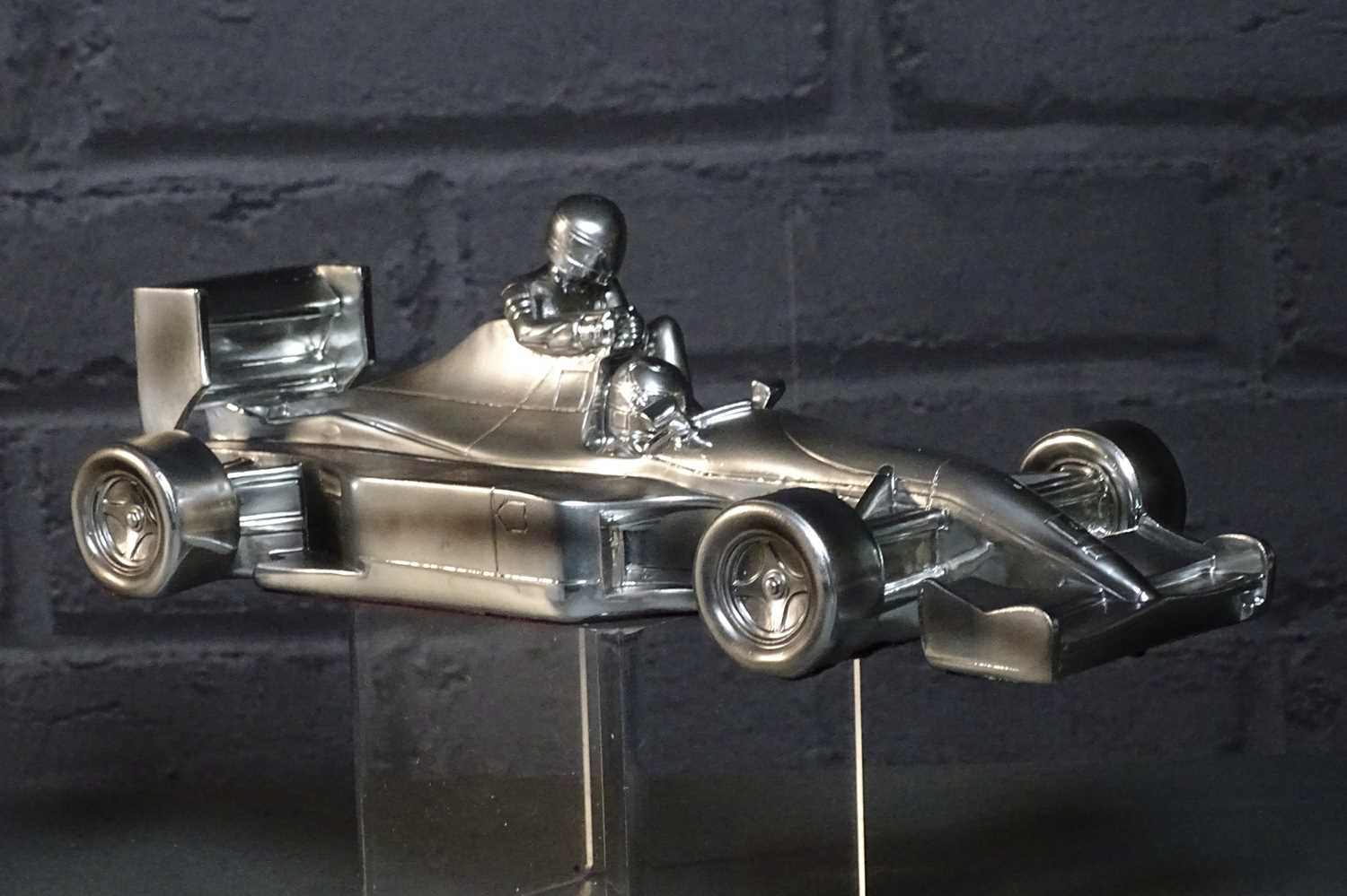 Lot 50 - Nigel Mansell chromed “Taxi for Senna” 1/18th sculpture signed with authenticity